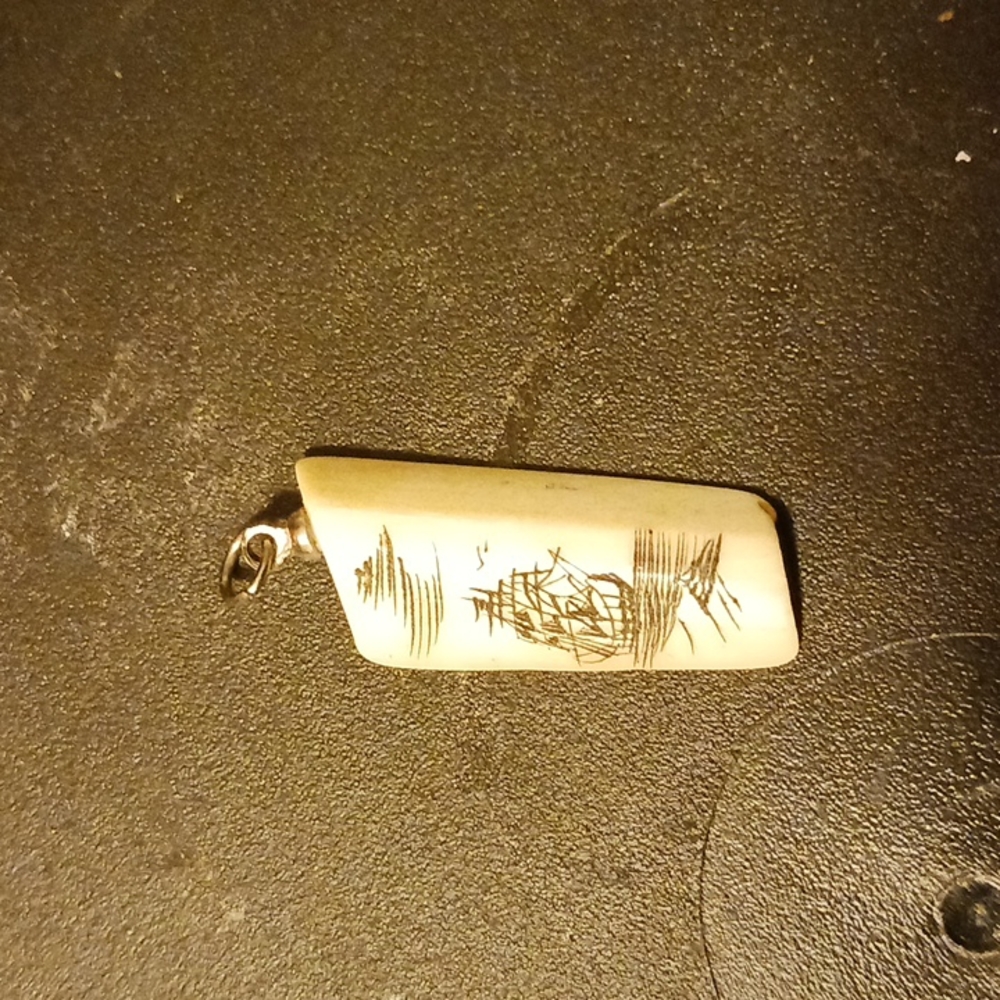 Authentic scrimshaw on bone pendant